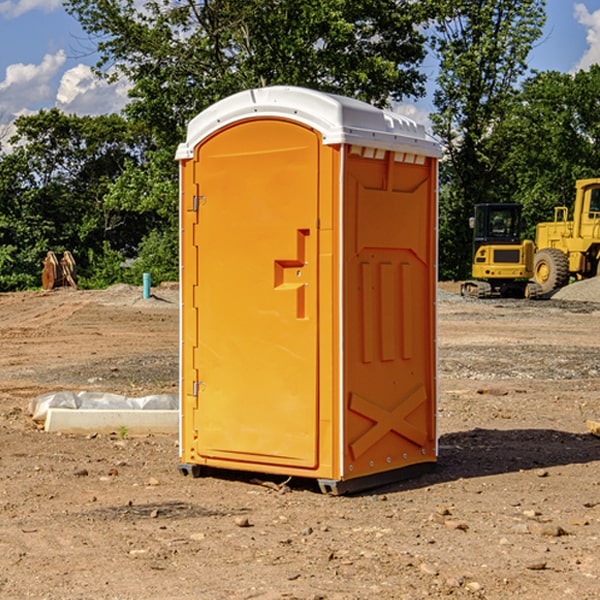 what is the cost difference between standard and deluxe portable toilet rentals in De Graff